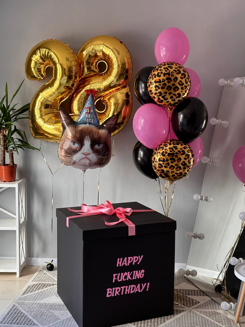 Custom adult birthday balloon arrangement with oversized gold number balloons, pink and black helium balloons, leopard print balloons, character balloon, and personalized black gift box in Los Angeles.