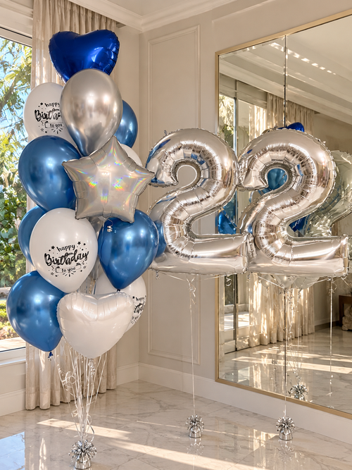Elegant blue and silver 22nd birthday balloon decoration featuring oversized silver number 22 foil balloons, metallic blue helium balloons, white birthday balloons, and decorative foil accents. Luxury birthday balloon arrangement by Best Balloons LA, offering birthday balloon delivery in Beverly Hills, Bel Air, Brentwood, and Los Angeles.