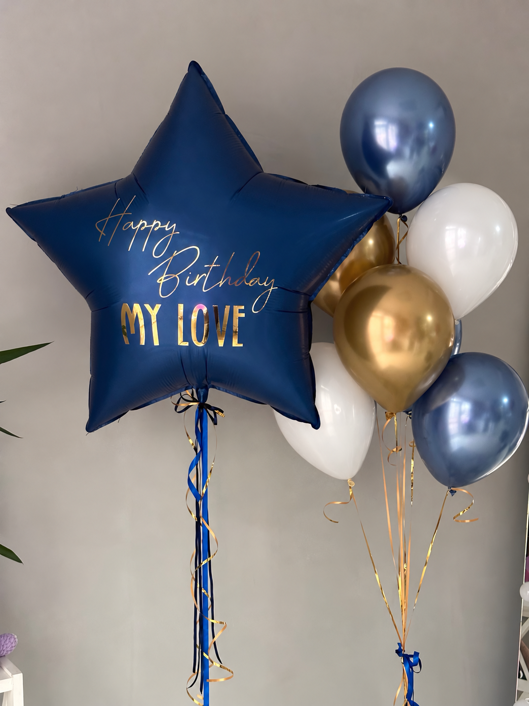 Elegant navy blue star-shaped Happy Birthday My Love foil balloon with gold lettering, paired with metallic gold, blue chrome, and white helium balloons for a luxury birthday surprise in Los Angeles